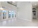 Spacious living room with waterfront views and tiled floors at 843 Harbor Is, Clearwater Beach, FL 33767