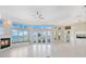 Bright living room with water views and fireplace at 843 Harbor Is, Clearwater Beach, FL 33767