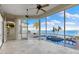 Relaxing screened-in patio overlooking the waterfront pool at 843 Harbor Is, Clearwater Beach, FL 33767