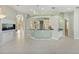 Wet bar with granite countertop and access to kitchen at 843 Harbor Is, Clearwater Beach, FL 33767