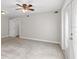 Spacious bedroom with ceiling fan and access to exterior at 914 E Cayuga St, Tampa, FL 33603