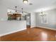 Dining area with hardwood floor and chandelier adjacent to kitchen at 914 E Cayuga St, Tampa, FL 33603