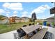 Large backyard with patio furniture and playground at 9512 Lemon Drop Loop, Ruskin, FL 33573