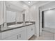 Bathroom with double vanity and granite countertop at 9512 Lemon Drop Loop, Ruskin, FL 33573