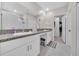 Bathroom with double vanity, granite countertop and access to closet at 9512 Lemon Drop Loop, Ruskin, FL 33573