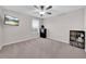 Well-lit bedroom with a bed and built-in shelving at 9512 Lemon Drop Loop, Ruskin, FL 33573
