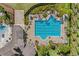 Large community lap pool with surrounding lounge chairs at 9512 Lemon Drop Loop, Ruskin, FL 33573
