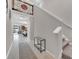 Bright and spacious entryway with staircase and view to living area at 9512 Lemon Drop Loop, Ruskin, FL 33573