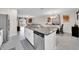 Kitchen with large island, stainless steel appliances, and granite countertops at 9512 Lemon Drop Loop, Ruskin, FL 33573
