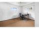 Home office with carpeted floor and ceiling fan at 9909 48Th N Ave, St Petersburg, FL 33708