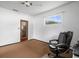 Bedroom with carpeted floor and exterior access at 9909 48Th N Ave, St Petersburg, FL 33708