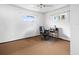 Spacious bedroom with carpeted floor and a work area at 9909 48Th N Ave, St Petersburg, FL 33708