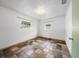Simple bedroom with tiled floors and large windows at 9909 48Th N Ave, St Petersburg, FL 33708