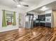 Kitchen features stainless steel appliances and wood floors at 9909 48Th N Ave, St Petersburg, FL 33708