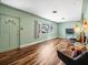Living room features hardwood floors and large windows at 9909 48Th N Ave, St Petersburg, FL 33708