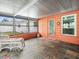 Spacious screened-in porch with tile floor at 9909 48Th N Ave, St Petersburg, FL 33708