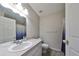 Clean bathroom with single sink vanity and shower/tub combo at 10107 N Arden Ave, Tampa, FL 33612