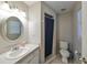 Clean bathroom with a shower/tub combo and updated vanity at 10107 N Arden Ave, Tampa, FL 33612