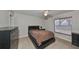 Bright bedroom with a double bed and ample closet space at 10107 N Arden Ave, Tampa, FL 33612