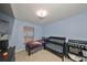 bedroom with crib, bed, and plenty of storage at 10107 N Arden Ave, Tampa, FL 33612