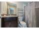 Clean bathroom with shower, toilet and granite vanity at 10832 Sage Canyon Dr, Riverview, FL 33578