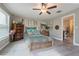 Charming bedroom with wood flooring and ensuite bathroom access at 10832 Sage Canyon Dr, Riverview, FL 33578