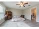 Spacious bedroom with wood flooring and ensuite bathroom access at 10832 Sage Canyon Dr, Riverview, FL 33578