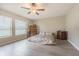 Spacious bedroom with wood flooring and ensuite bathroom access at 10832 Sage Canyon Dr, Riverview, FL 33578