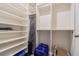 Spacious walk-in closet with ample shelving and hanging space at 10832 Sage Canyon Dr, Riverview, FL 33578