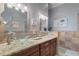 Elegant bathroom with double sinks, granite countertops, and a large soaking tub at 1109 Pinellas Bayway S # 403, Tierra Verde, FL 33715