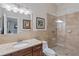 Clean bathroom with a single vanity, granite countertop, and shower at 1109 Pinellas Bayway S # 403, Tierra Verde, FL 33715