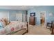 Spacious main bedroom with a comfortable bed and ensuite bathroom at 1109 Pinellas Bayway S # 403, Tierra Verde, FL 33715