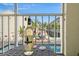 Enjoy a glass of wine on this screened balcony with pool views at 1109 Pinellas Bayway S # 403, Tierra Verde, FL 33715