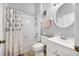 Clean bathroom with a bathtub, shower, and white vanity at 11310 Palm Island Ave, Riverview, FL 33569