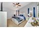 Spacious bedroom with a queen bed and ample natural light at 11310 Palm Island Ave, Riverview, FL 33569