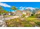 Front view of a single-story house with a palm tree and driveway at 11310 Palm Island Ave, Riverview, FL 33569