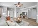 Living room with a view of the front entry and kitchen at 11310 Palm Island Ave, Riverview, FL 33569