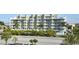 Multi-story building with lush landscaping at 11605 Gulf Blvd # 302, Treasure Island, FL 33706