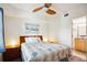 Bedroom with a queen bed and access to the bathroom at 11605 Gulf Blvd # 302, Treasure Island, FL 33706