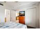 Bedroom with a queen bed and built-in closet at 11605 Gulf Blvd # 302, Treasure Island, FL 33706