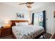 King-size bed, ocean-view balcony, and wood dresser at 11605 Gulf Blvd # 302, Treasure Island, FL 33706