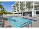 Relaxing pool area with plenty of lounge chairs at 11605 Gulf Blvd # 302, Treasure Island, FL 33706