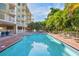 Tranquil pool and surrounding landscape at 11605 Gulf Blvd # 302, Treasure Island, FL 33706