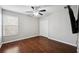 Spacious bedroom with hardwood floors and ceiling fan at 12509 Bay Branch Ct, Tampa, FL 33635