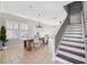 Bright dining room with stairs and marble-top table at 12509 Bay Branch Ct, Tampa, FL 33635