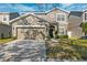 Two-story house with a two-car garage and landscaped lawn at 12509 Bay Branch Ct, Tampa, FL 33635