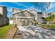 Two-story house with a two-car garage and landscaped lawn at 12509 Bay Branch Ct, Tampa, FL 33635