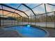 Enclosed pool and patio area with water feature at 12509 Bay Branch Ct, Tampa, FL 33635