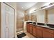 Bathroom with double vanity, large shower and linen closet at 12610 Geneva Glade Dr, Riverview, FL 33578