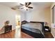 Spacious bedroom with wood floors and ensuite bathroom at 12610 Geneva Glade Dr, Riverview, FL 33578